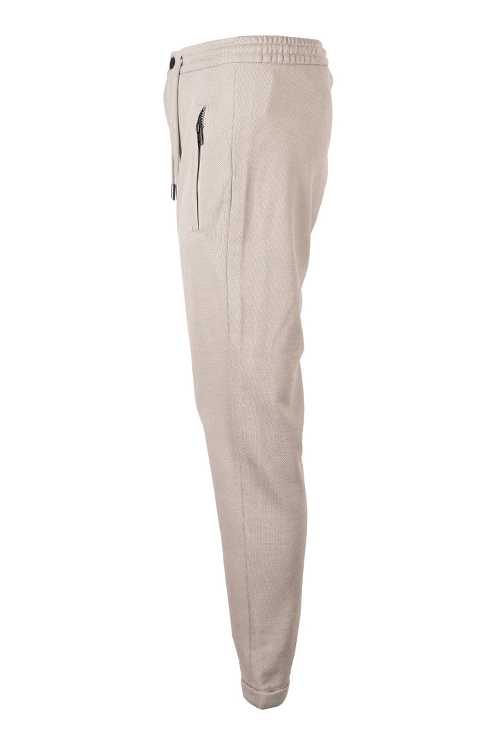 Pantalone jogger uomo Coveri Collection in texure piquet con coulisse e tasche con cerniera sui fianchi