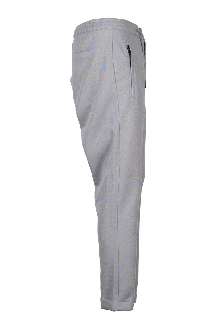 Pantalone jogger uomo Coveri Collection in texure piquet con coulisse e tasche con cerniera sui fianchi