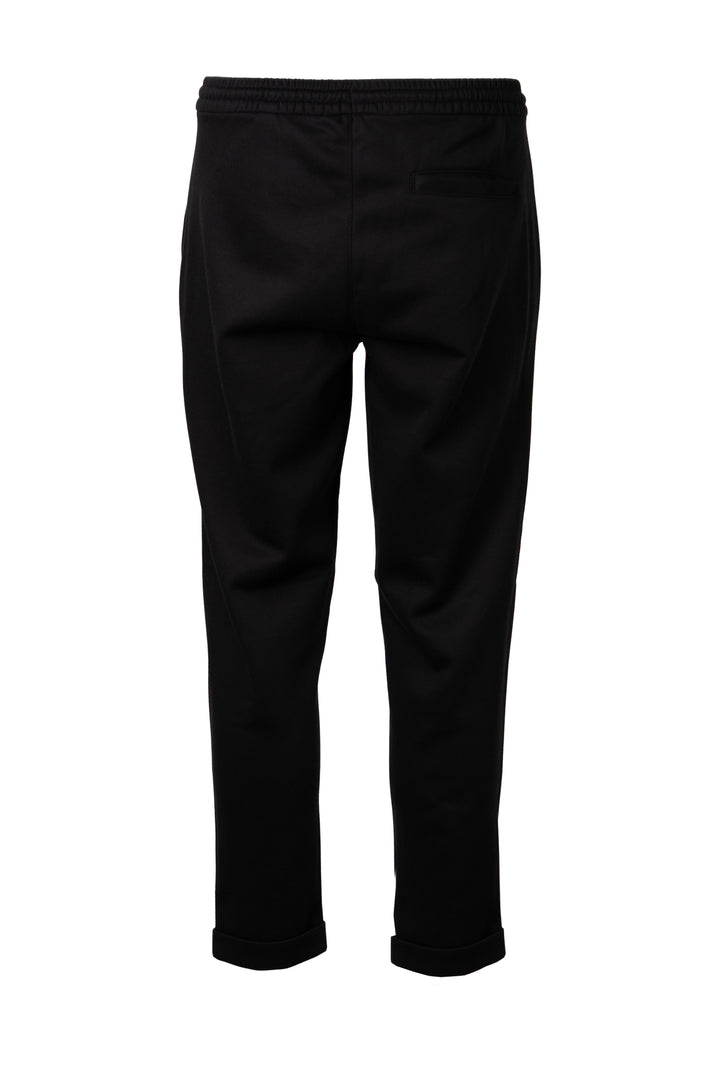Pantalone jogger uomo Coveri Collection in texure piquet con coulisse e tasche con cerniera sui fianchi