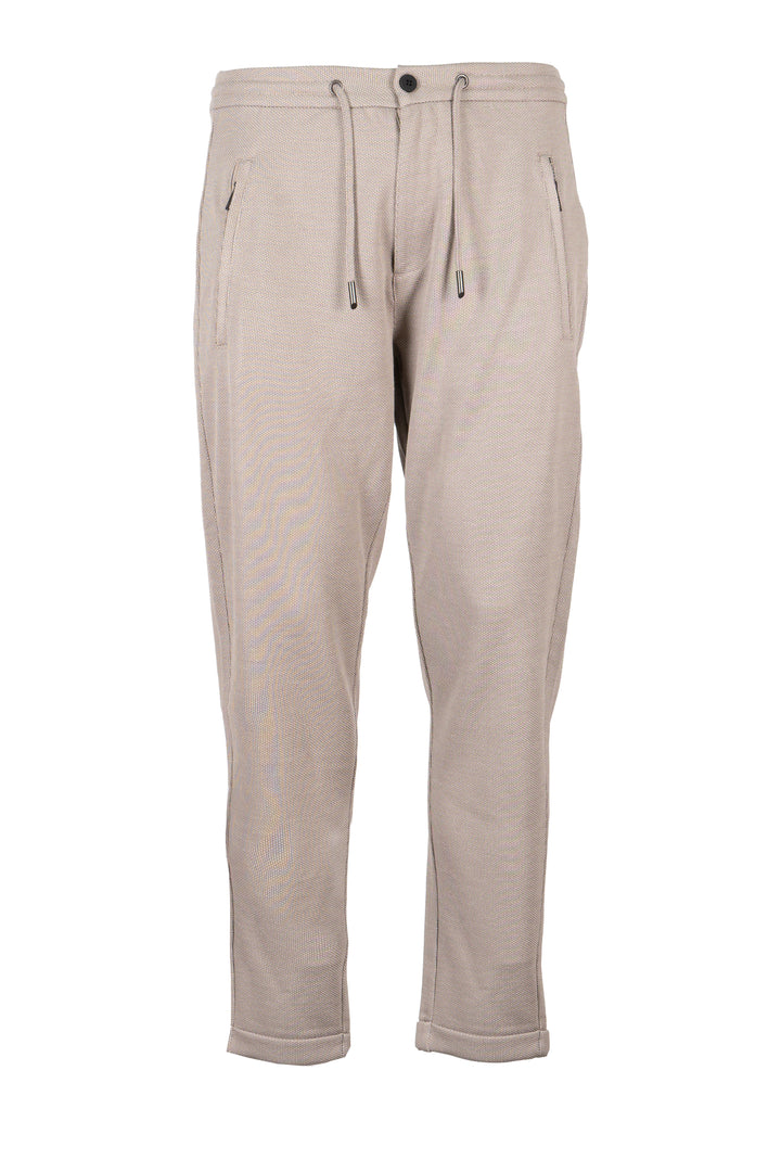 Pantalone jogger uomo Coveri Collection in texure piquet con coulisse e tasche con cerniera sui fianchi